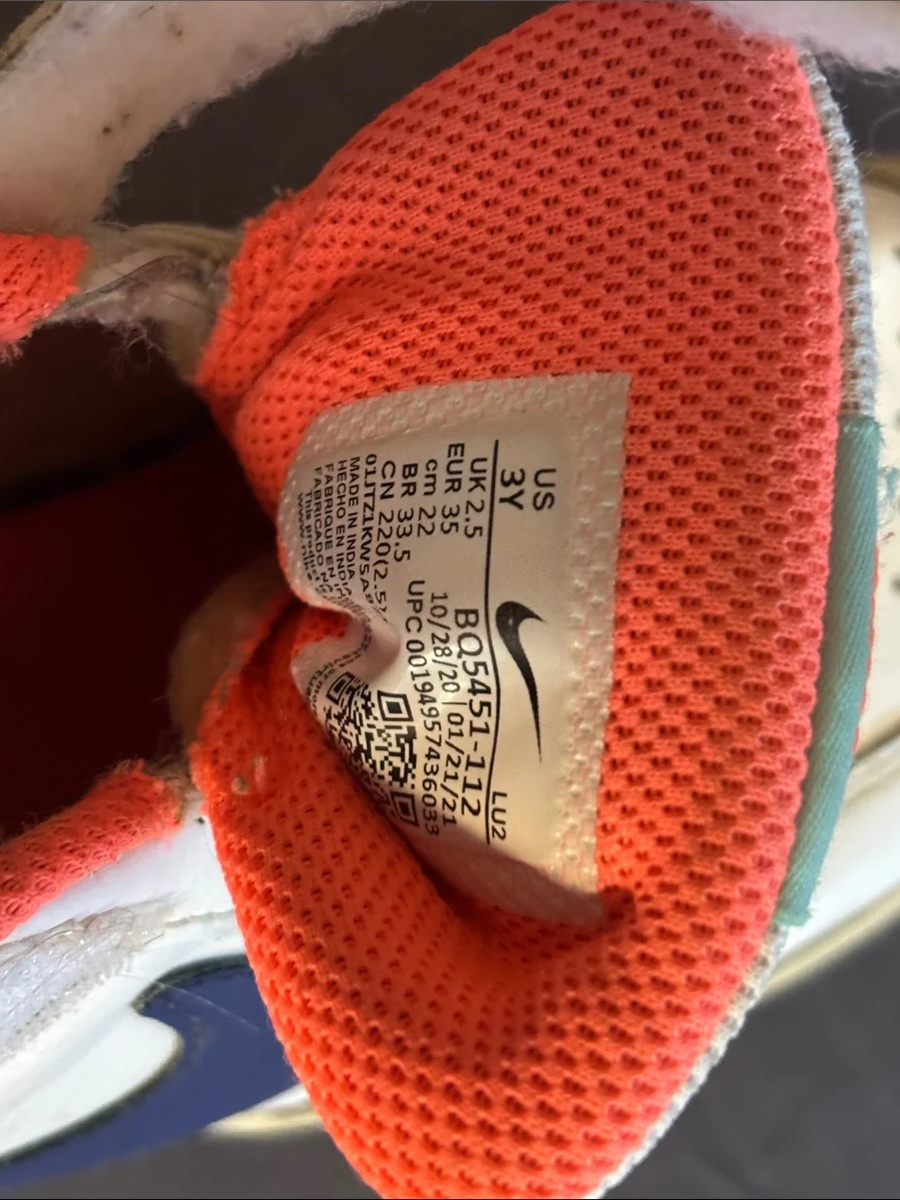 Nike Kids White Sneakers with Blue Swoosh and Orange Lining